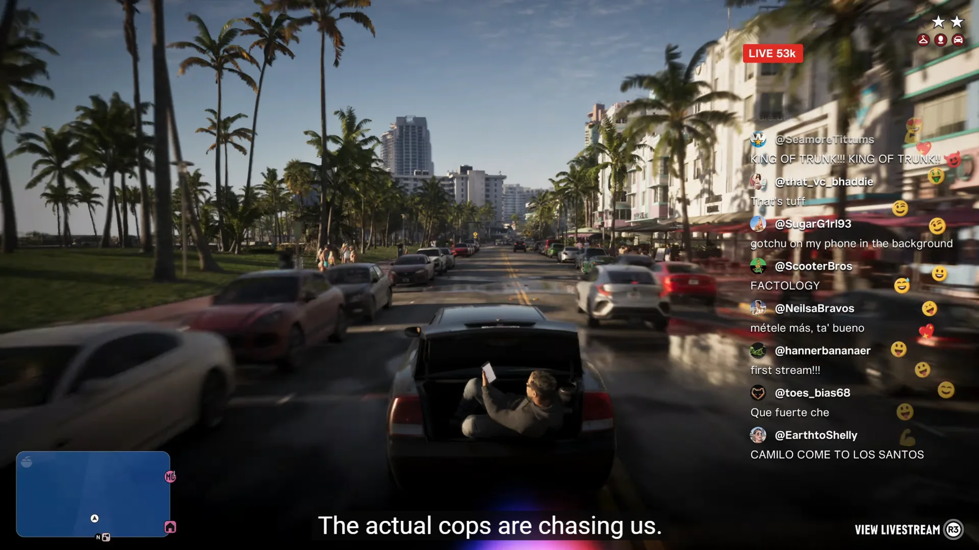 A Grand Theft Auto VI car speeds down a palm-lined street with a man filming from the open trunk while a livestream chat and viewer count overlay the screen.