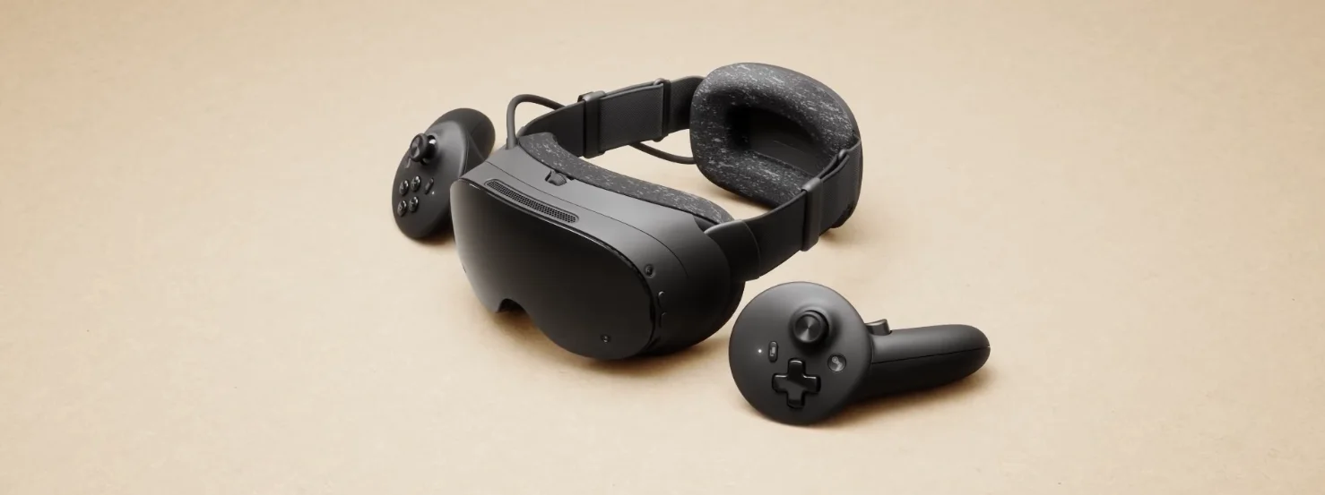 Steam Frame headset and controllers arranged at an angle on a beige background
